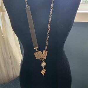 Unique gold necklace with clock and chunky accents